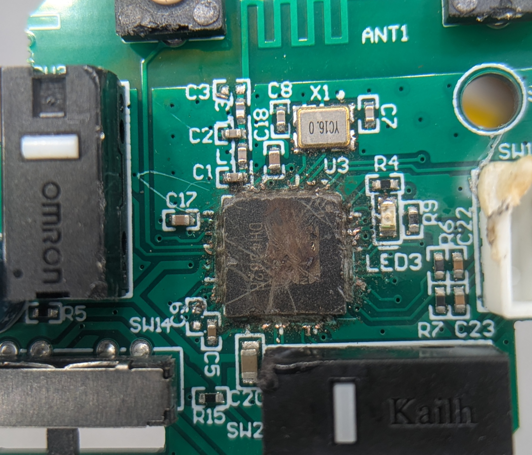 Scratched up EX-G micro-controller with contacts removed