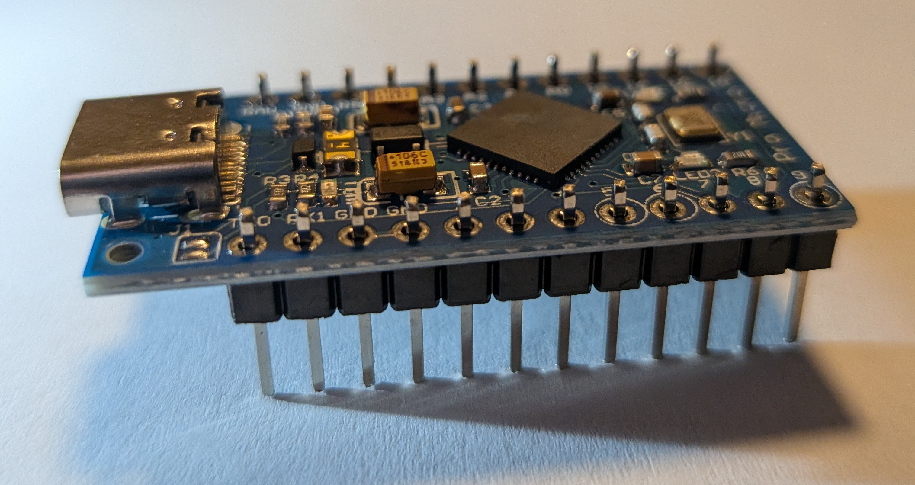Image of pin headers inserted into Atmega board